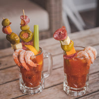 two bloody marys with garnish